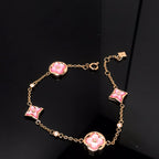 ¡®Lumi¡¯STAR AND SUN 4 MOTIF PINK MOP PINK GOLD BRACELET