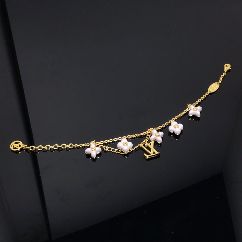 ¡®Lumi¡¯LOGO 6 MOTIF STAR AND SUN GOLD BRACELET